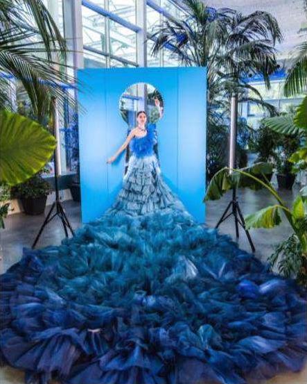 Performer against a blue lit backdrop