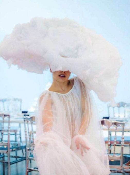 Performer in a white cloud gown