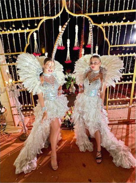 Performers in feathered costume