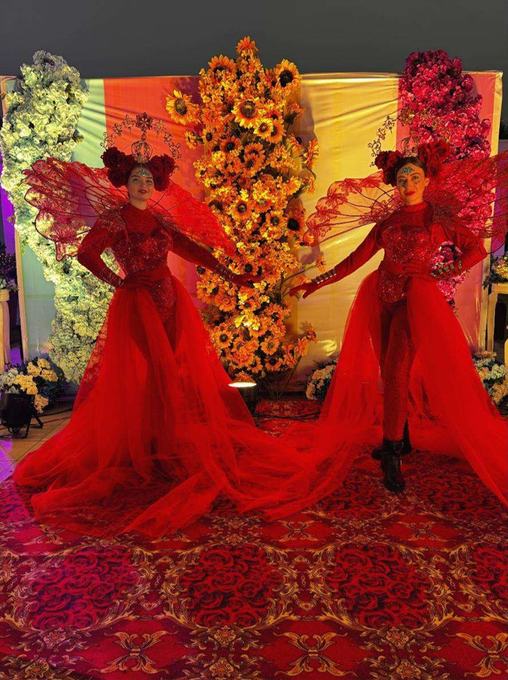 Performers with red wings