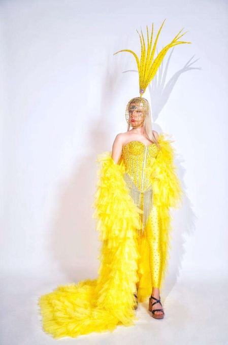 Performer in a vivid yellow costume