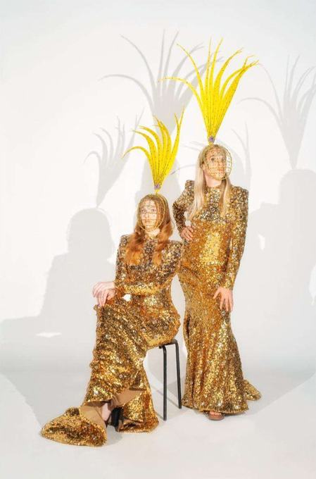 Performers in gold sequins