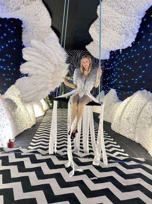 Performer on a decorated swing