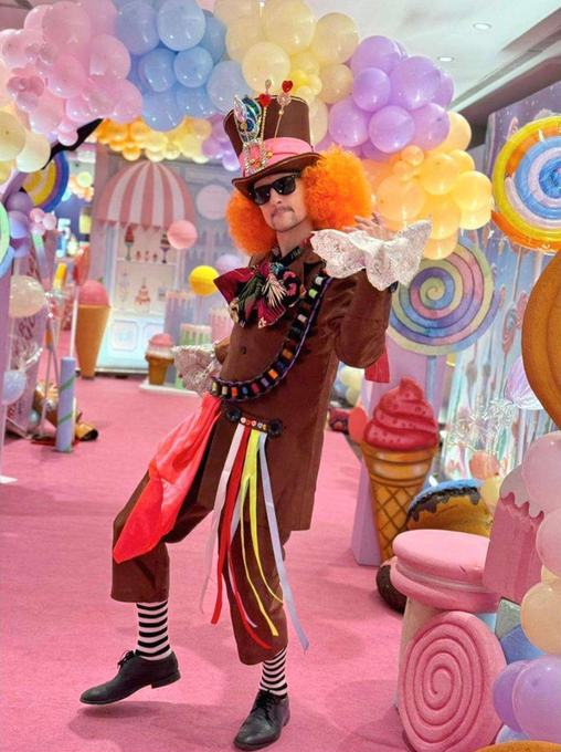 Costumed performer against a backdrop