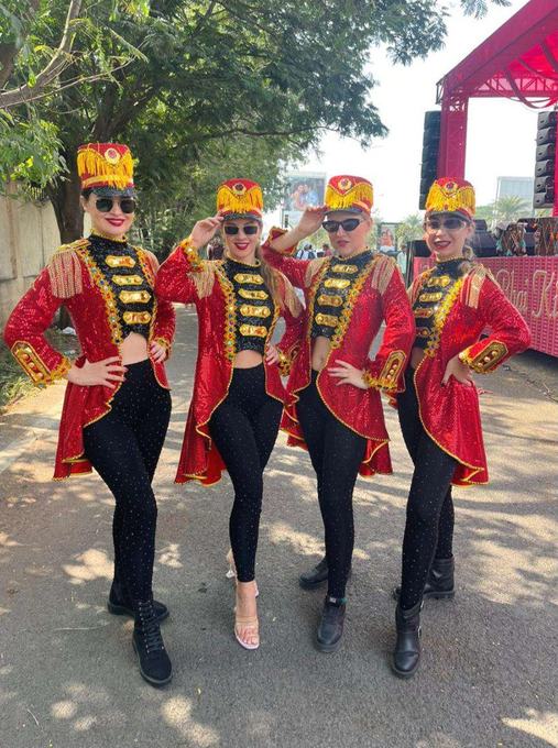 Performers in red baraat costume