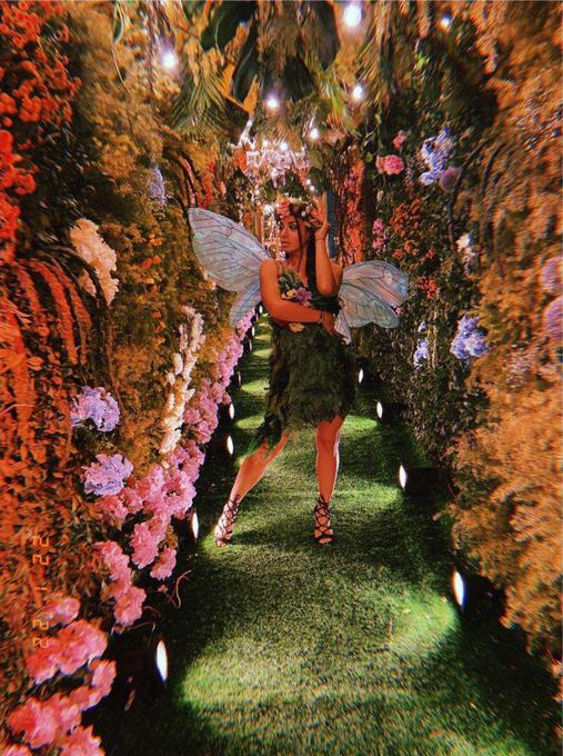 Performer in a green fairy costume