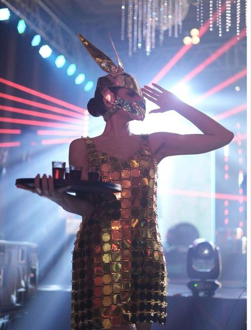 Performer in a gold sequined costume