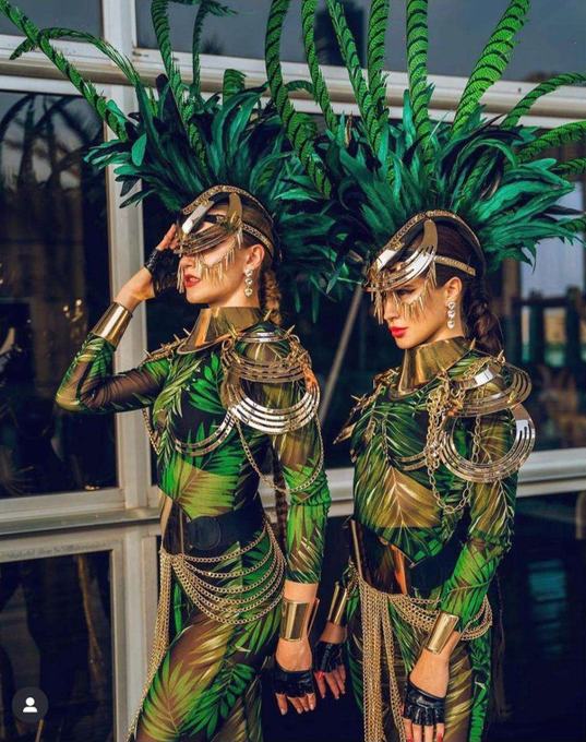 Performers in green costume