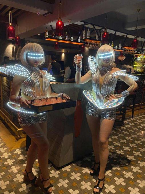 Performers in futuristic costume