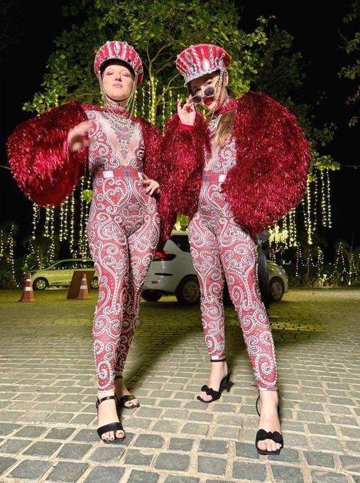 Costumed performers on cobblestone