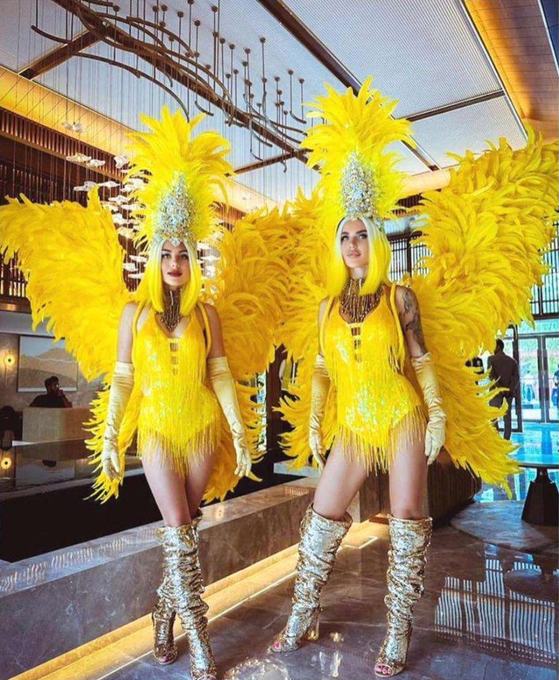 Performers in yellow carnival costume