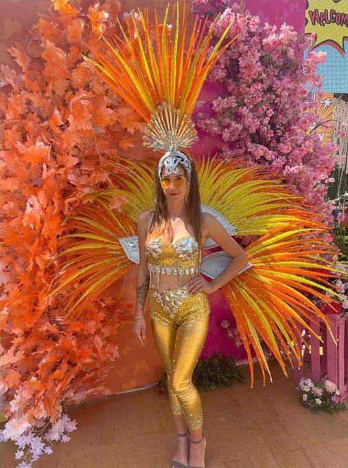 Performer against a floral backdrop