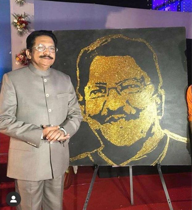 Glitter portrait presented to a guest