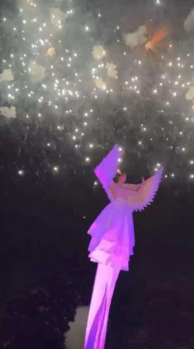 Illuminated sway pole performer