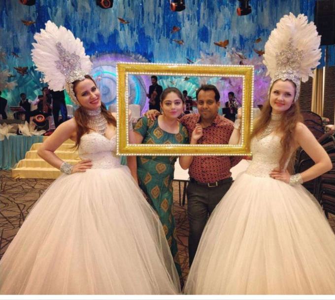 Selfie frame hosts in ball gowns