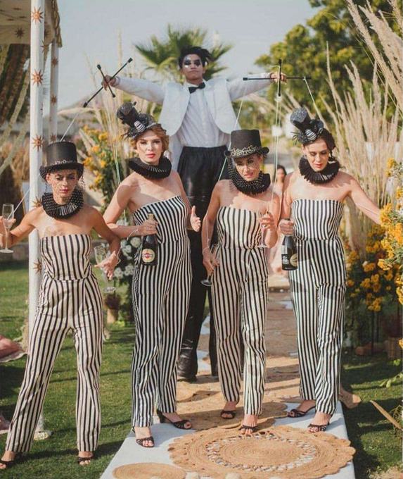 Puppet servers in striped costume