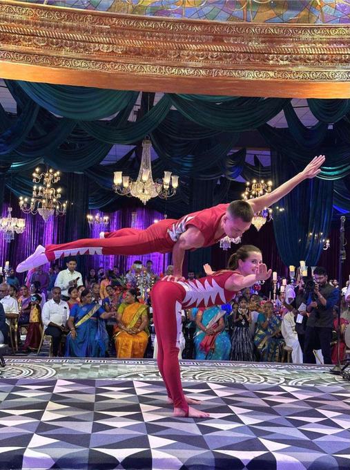 Acrobatic couple on a chequered floor