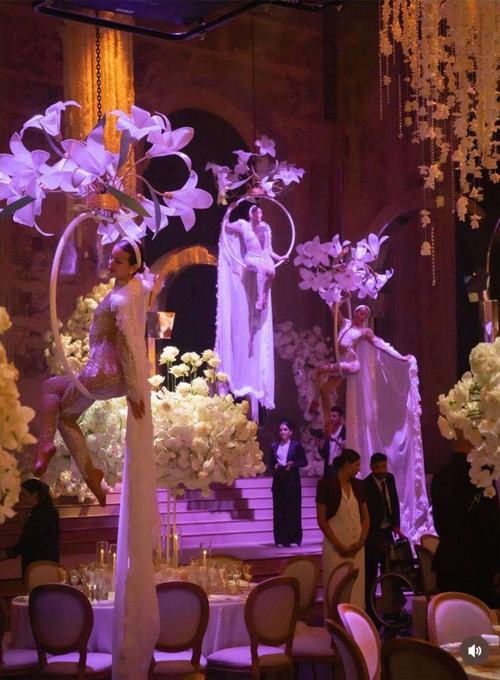 Aerial dancers under purple light
