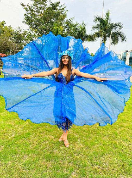 Entry performer in blue wings